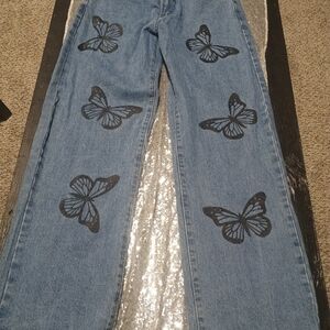Rue21 Blue Jeans with Black Butterfly Design